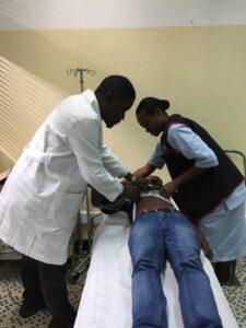 Doctor reviewing patient documents at Holistic Care Medicals