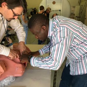 Medical professionals attending to a patient at Holistic Care Medicals