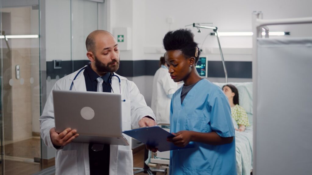 african-nurse-surgeon-doctor-medical-uniform-analyzing-illness-symptom-working-hospital-ward - Holistic Care Medicals