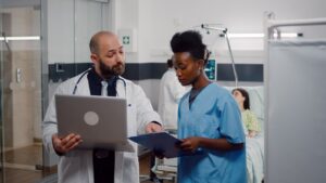 african-nurse-surgeon-doctor-medical-uniform-analyzing-illness-symptom-working-hospital-ward - Holistic Care Medicals